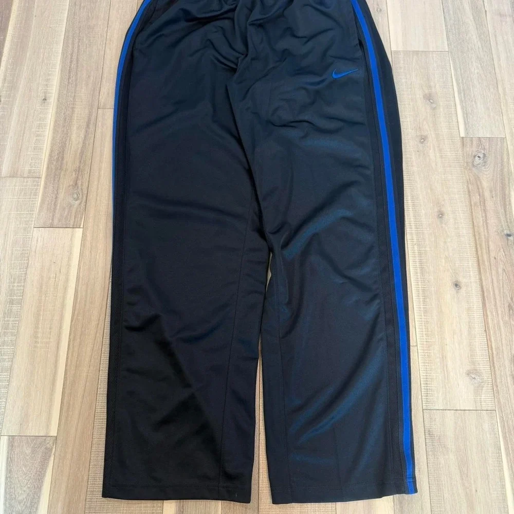 2000s baggy Nike black track pants with blue stripe sz XL